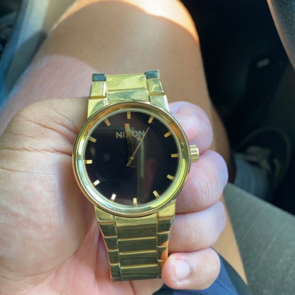 gold nixon watch